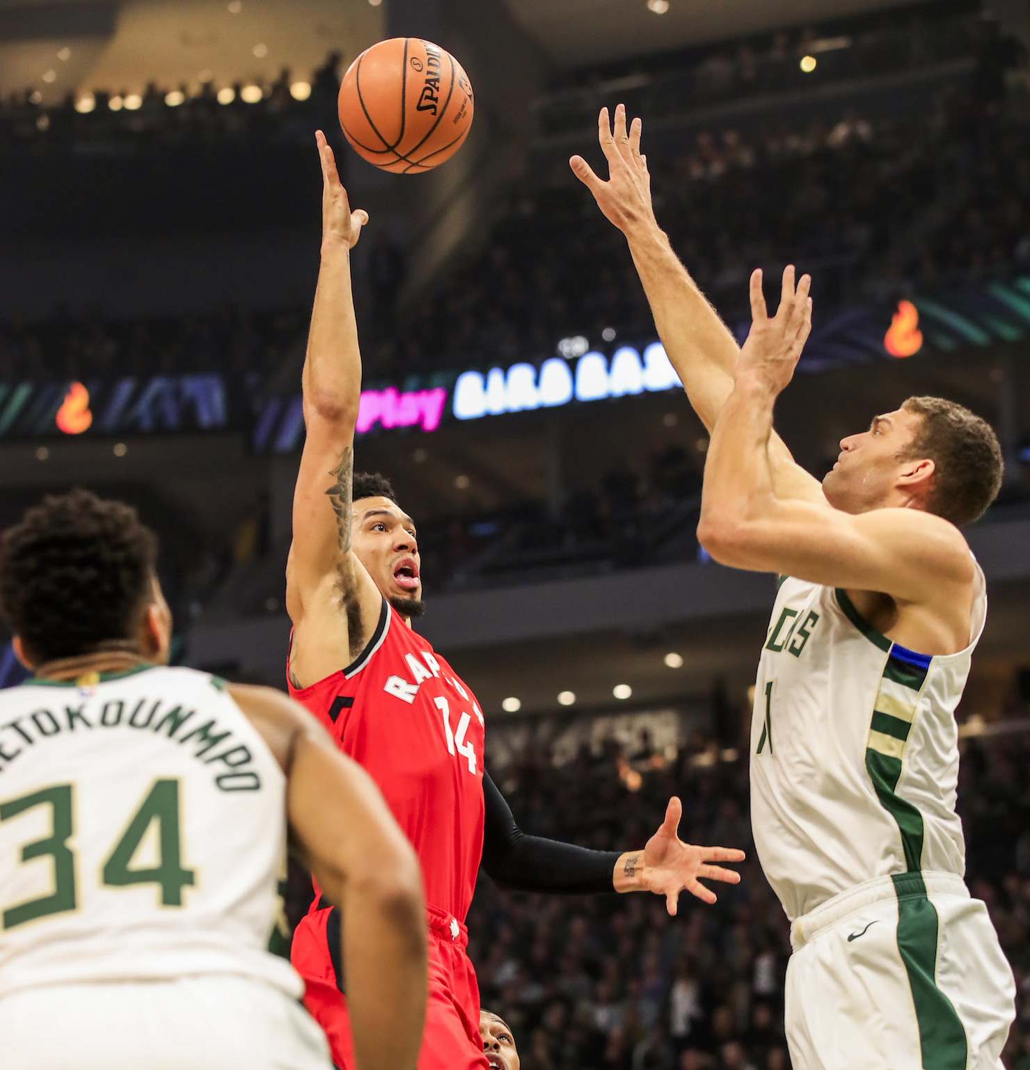 Toronto Raptor Danny Green puts up a shot over Brook Lopez of the Milwaukee Bucks.