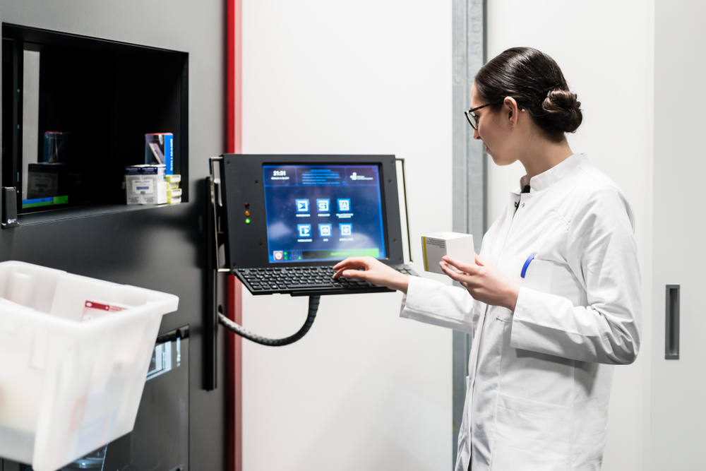 A chemist uses a computer.