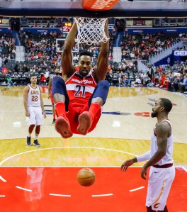 Dwight Howard dunks as J.R. Smith and Larry Nance, Jr. look on.