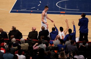 Former New York Knicks center Kristaps Porzingis walks to the bench.