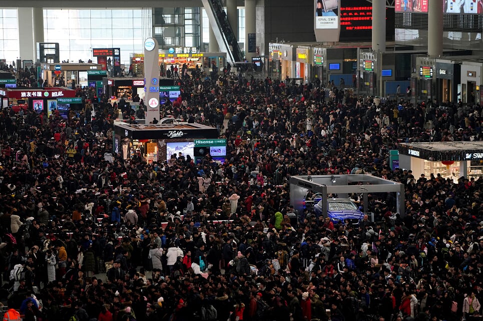 Passengers wait to board trains at Shanghai's Hongqiao Railway Station as the annual Spring Festival travel rush begins ahead of the Chinese Lunar New Year in Shanghai