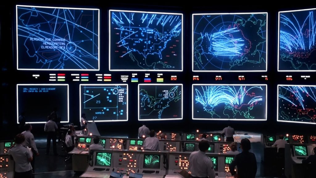 Multiple simulations of nuclear war running at once at the end of 1983's 'Wargames' in a massive NORAD commander center.