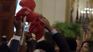 black conservative with MAGA hats