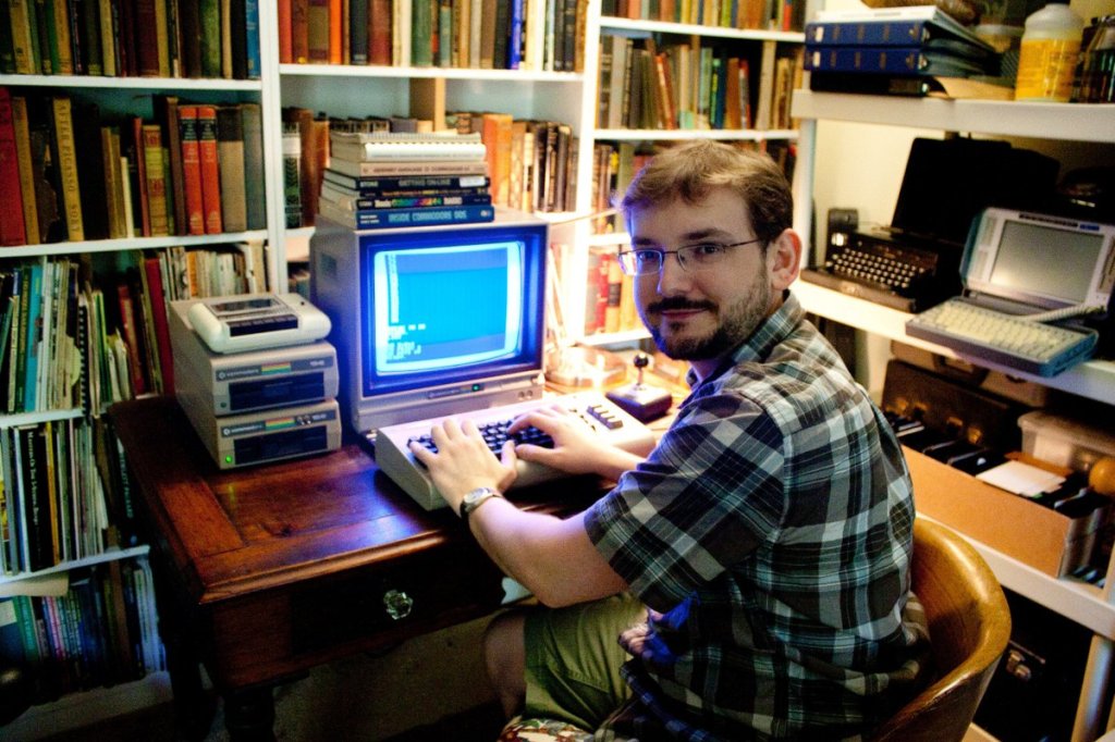 Tech historian Benj Edwards sitting at a desk.