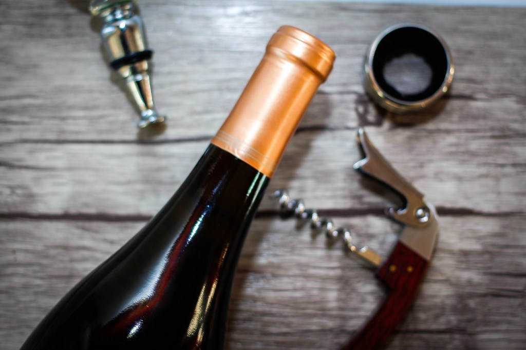 wine bottle being opened corkage