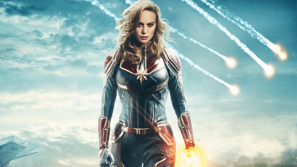 Captain Marvel promo image with meteors falling to earth behind her