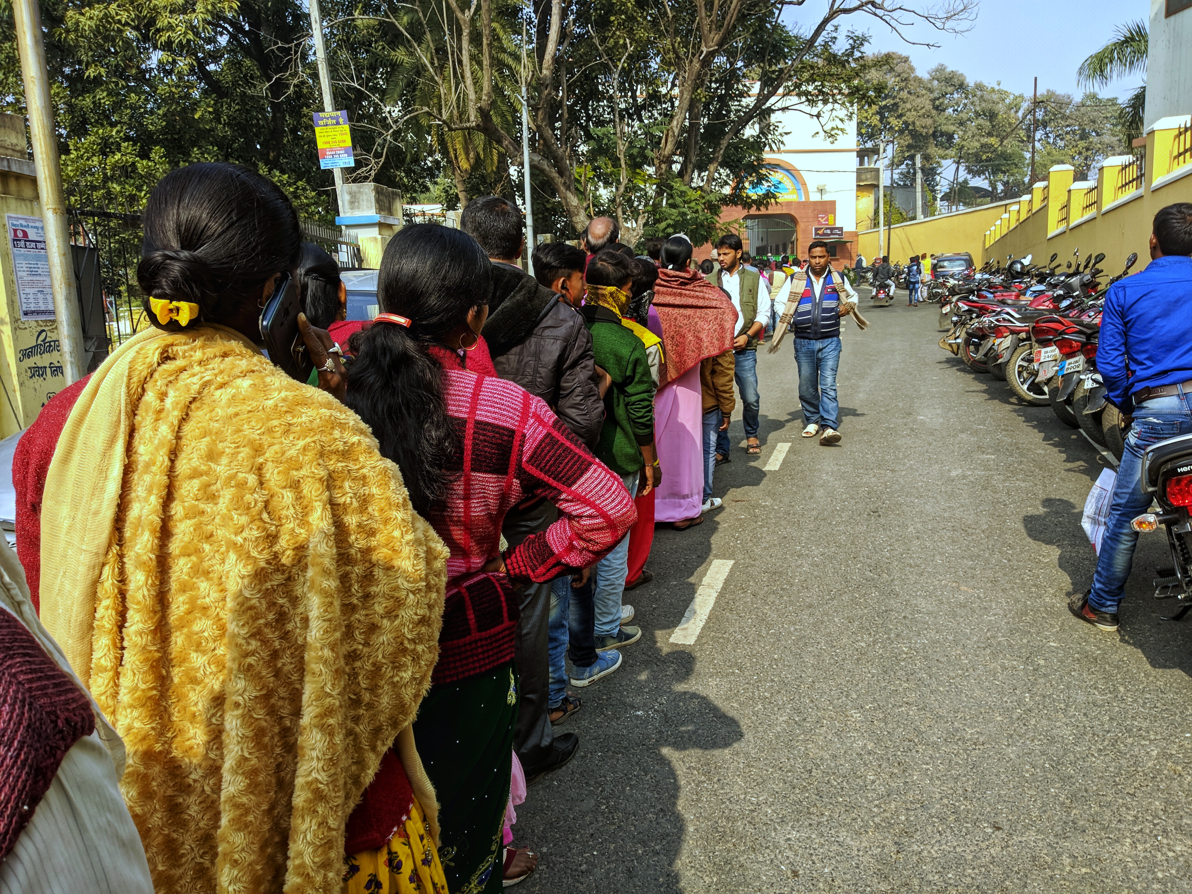 1551695983380-The-queue-outside-the-yoga-ashram-in-Munger