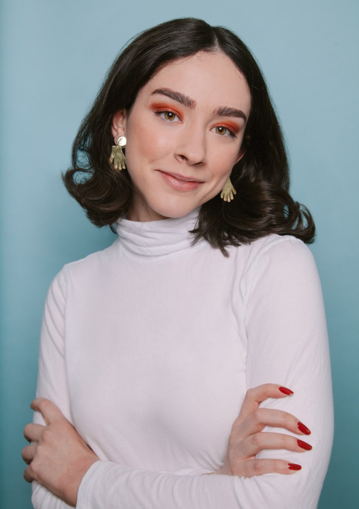 Gabby Noone in orange eyeshadow in a photo by Sandy Honig.