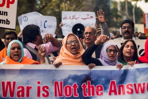 Women lead an anti-war protest in Lahore.