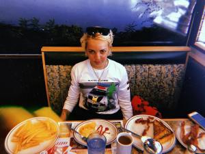 A portrait of Laia Garcia in a diner booth.