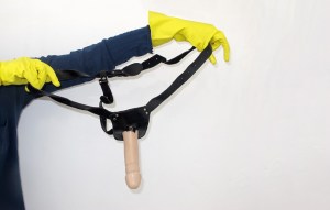 A person holding a strap-on.