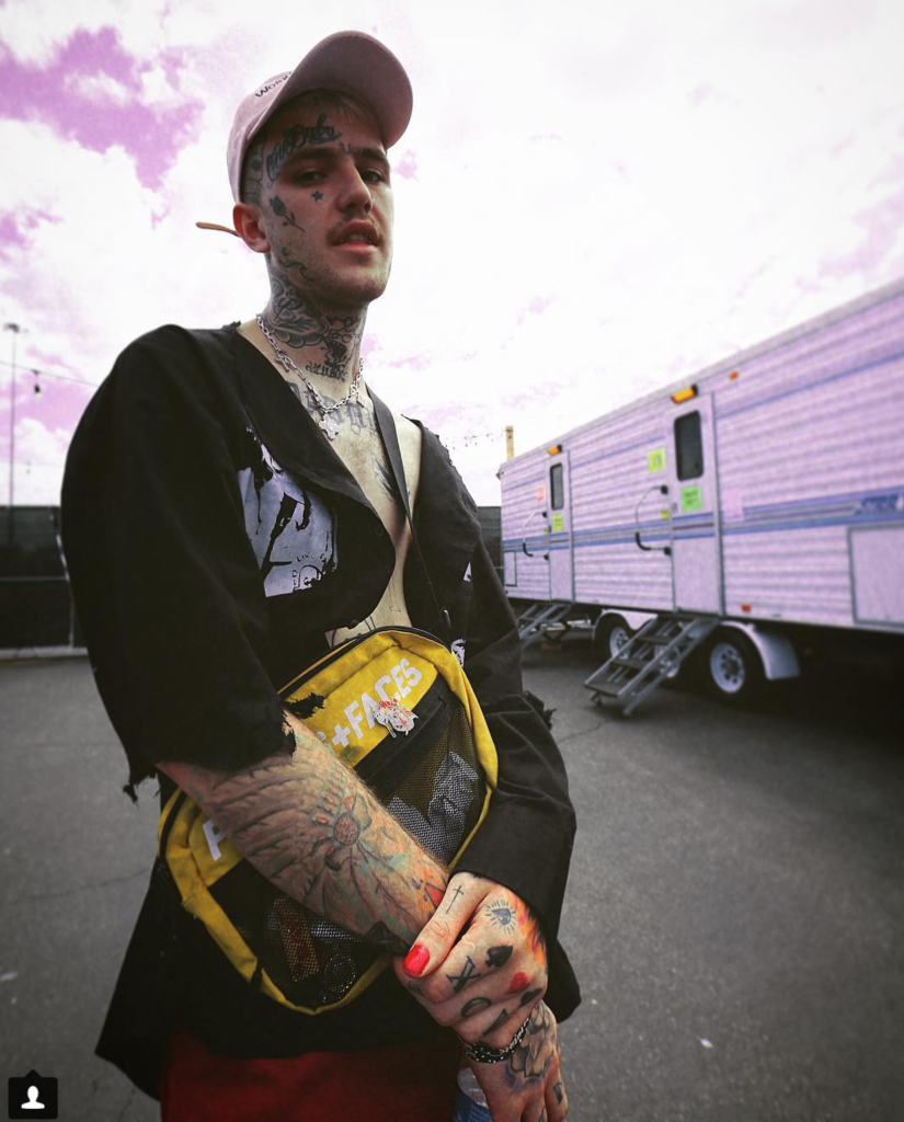 Lil Peep standing backstage at a musical festival