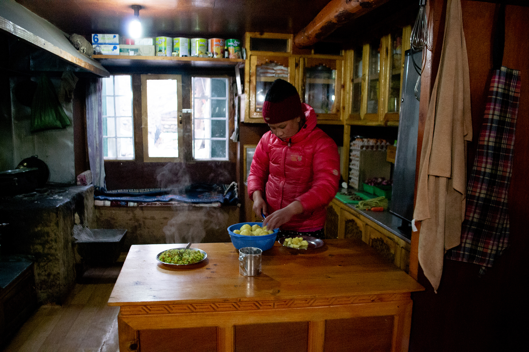 1554223521625-Mingma-Sherpa-cooking-dinner-at-her-familys-teahouse-in-Phortse-Gaon-2