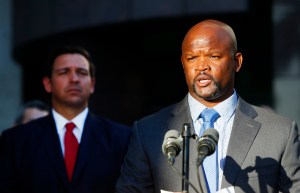 Then-acting Sheriff Gregory Tony, right, speaks at the Broward County Sheriff's Office Fort Lauderdale headquarters