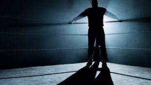 Dark Side of the Ring promo art depicting a silhouetted figure against the turnbuckle of a ring.