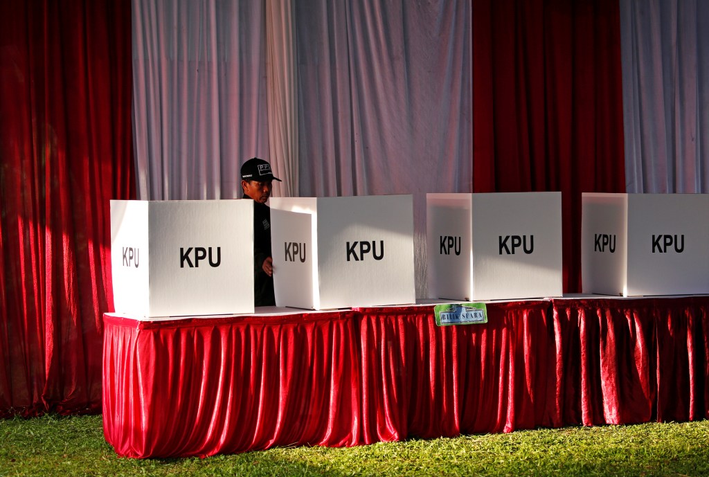 security at a polling station in Indonesia