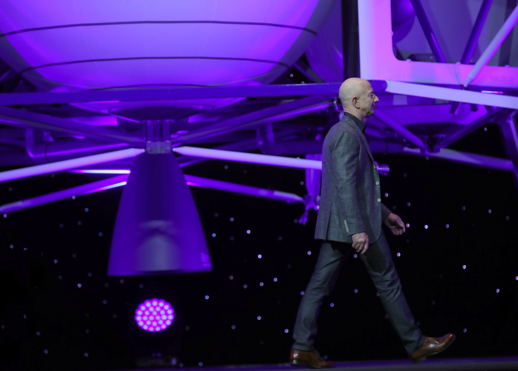 Jeff Bezos, owner of Blue Origin, walks off stage after introducing a new lunar landing module called Blue Moon during an event at the Washington Convention Center.