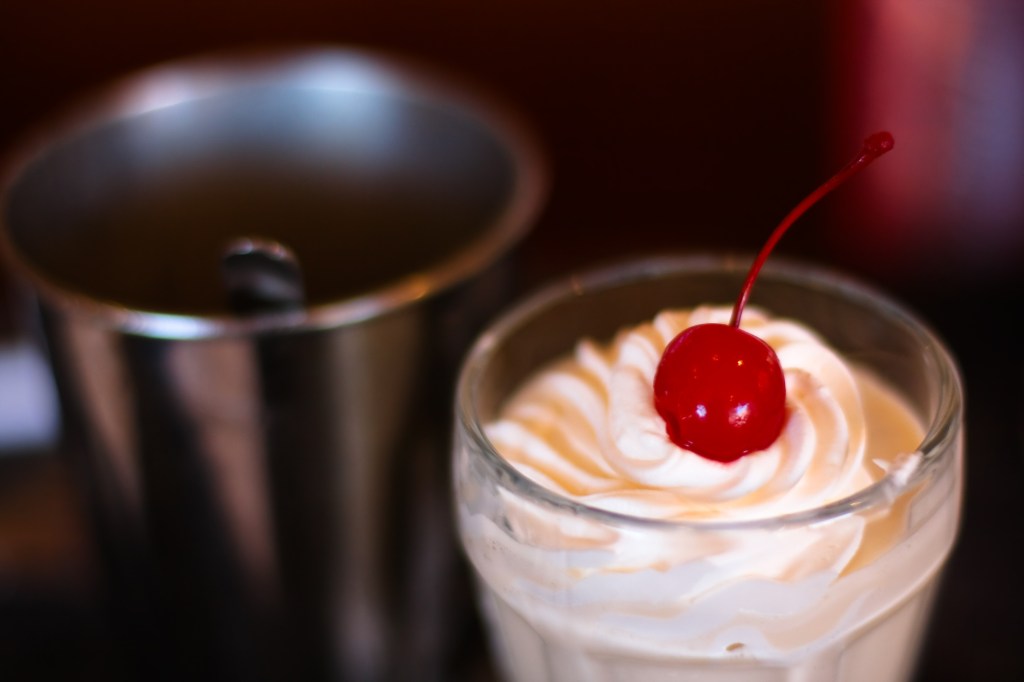 milkshake with whipped cream and cherry