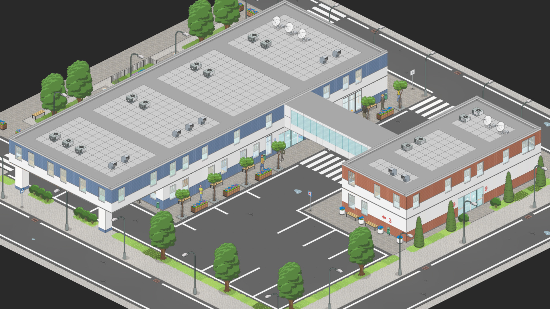 A small hospital complex with a connecting skybridge