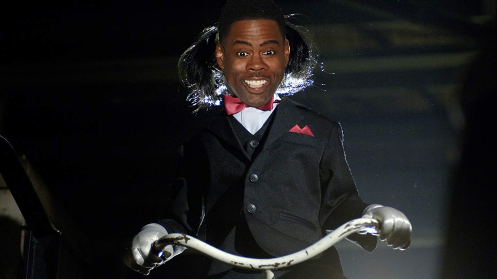 Chris Rock as the Saw puppet