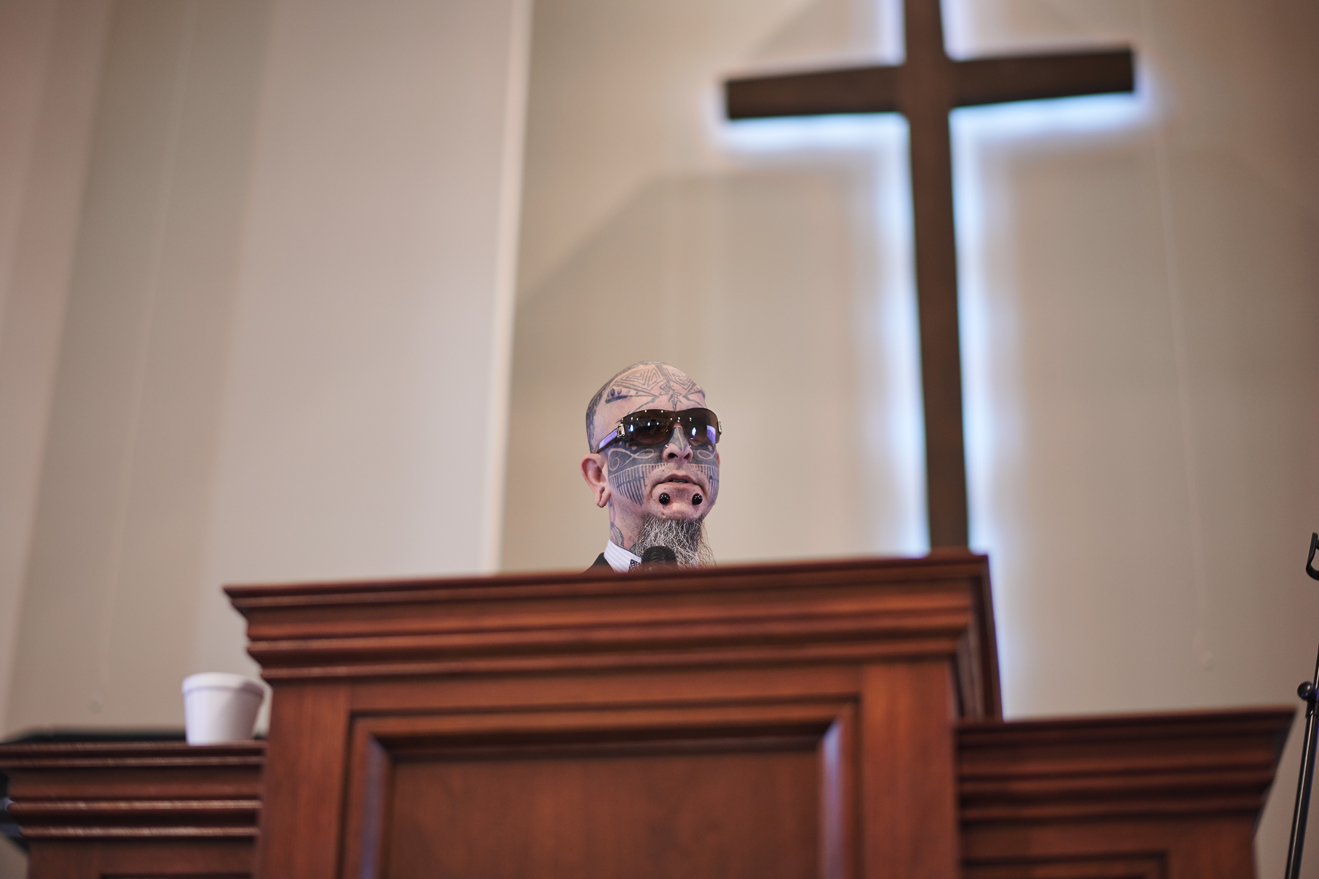 Pastor Cali from Sermon in the Park Church of Victoria, Texas, preaches. Photo by Finlay MacKay.