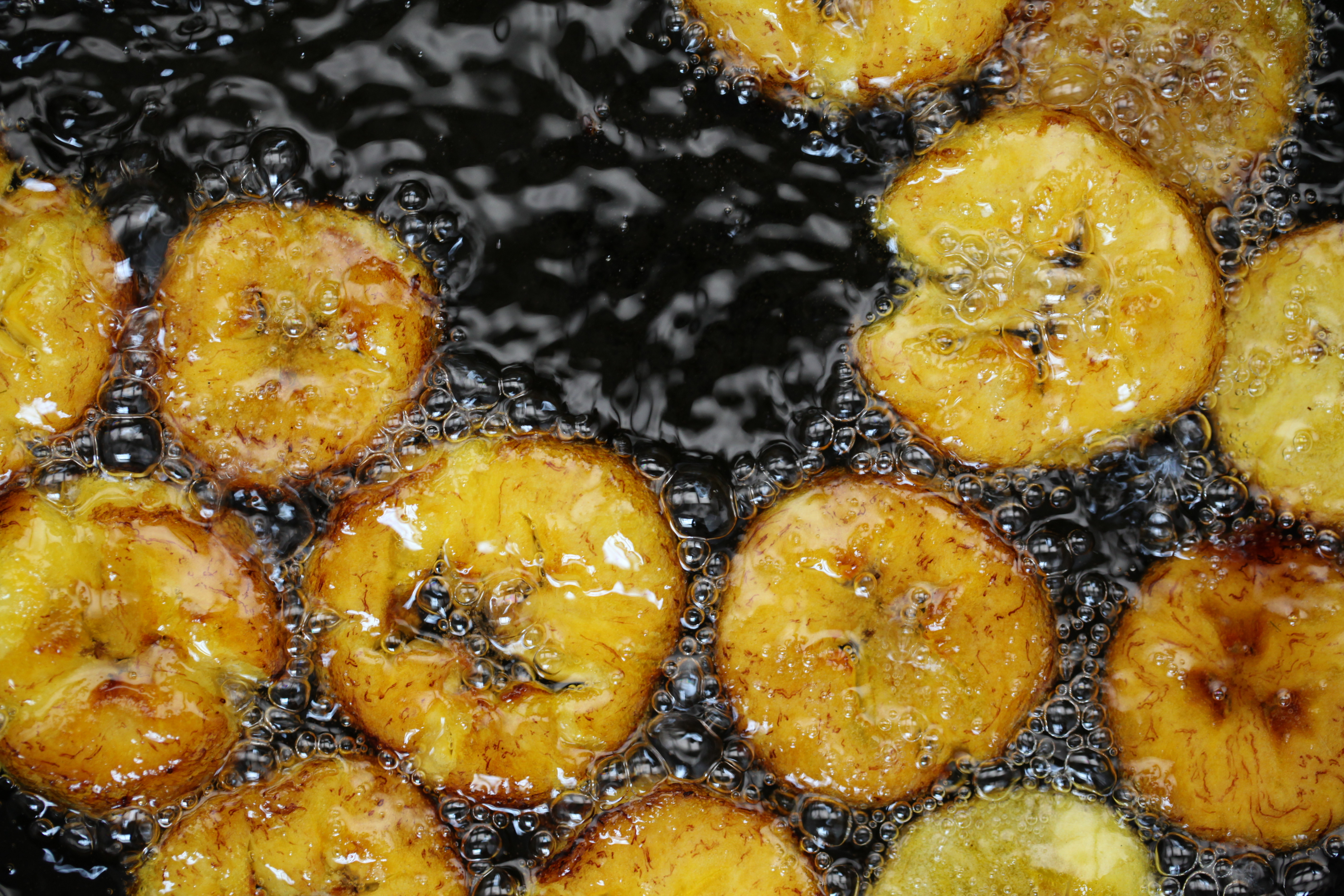 rounds of plantains frying in oil