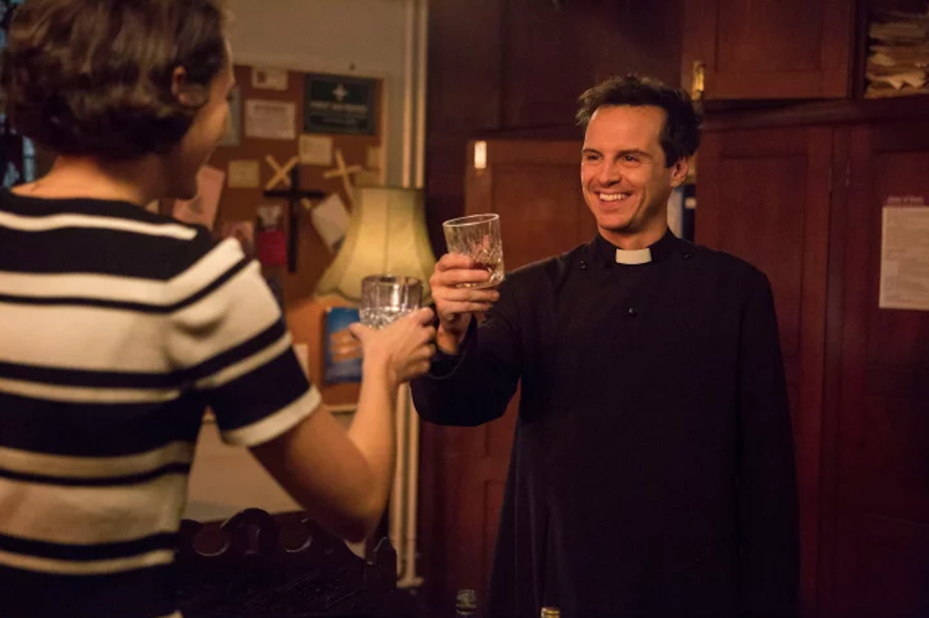 the hot priest from fleabag toasting