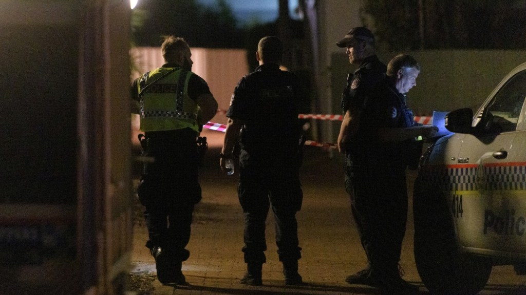 Police cordon off a block of units where a person was shot by a gunman in the suburb of The Gardens in Darwin​.