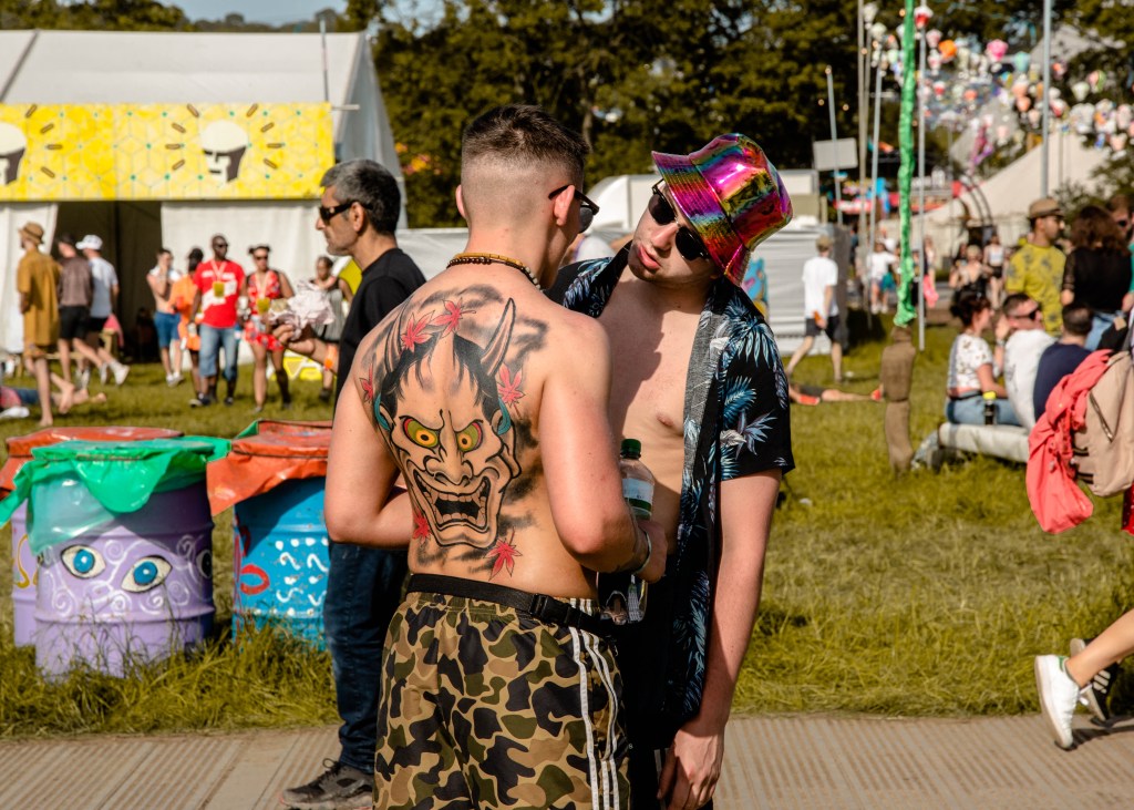 Two guys talking at Glastonbury 2019