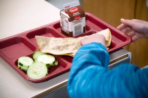 A Pennsylvania education official is defending his district’s threat to parents who owed money for school lunches to pay up or be referred to a court that could place their children in foster care.