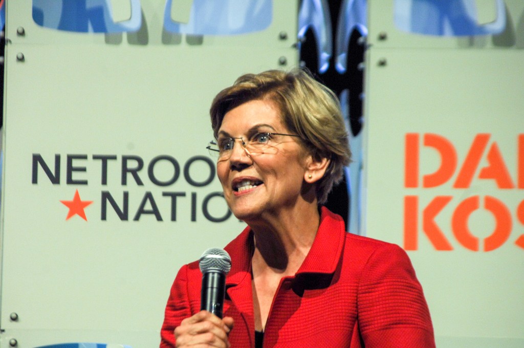 Elizabeth Warren holding a microphone