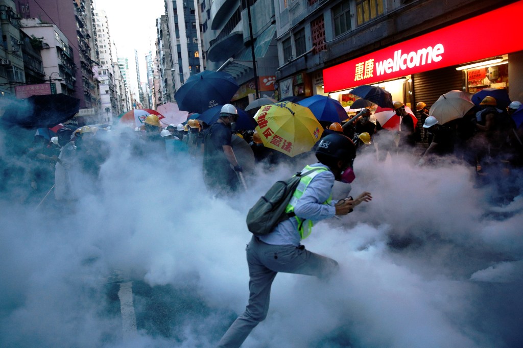 Demonstrators clash with police during a protest against police violence during previous marches, near China's Liaison Office, Hong Kong, China July 28