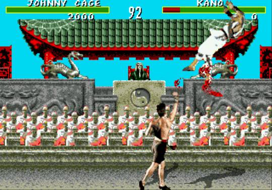 Mortal Kombat - Genesis version image featuring Johnny Cage killing Kano in a spray of blood.