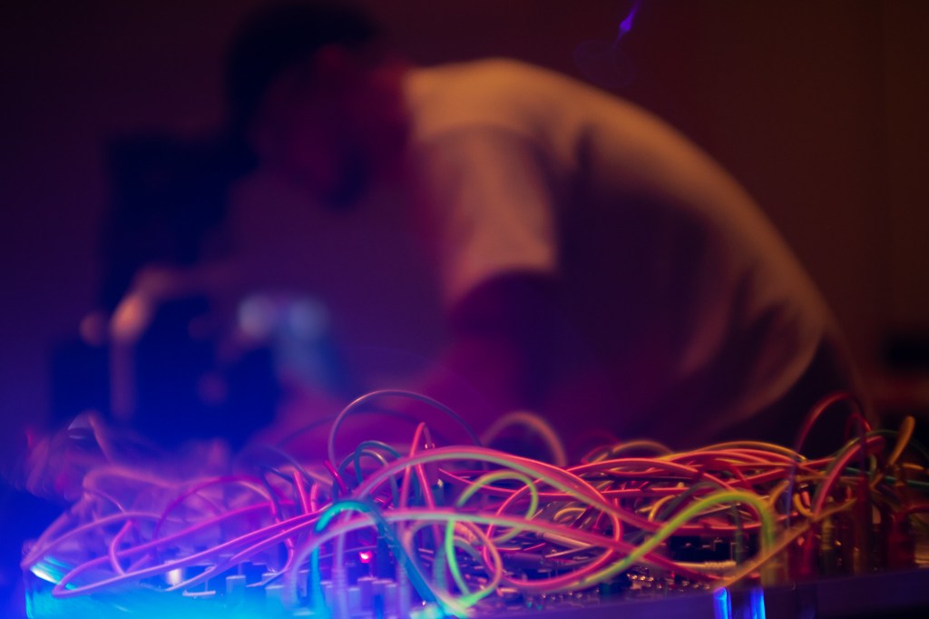 A person at Def Con 27 with cords in the foreground.