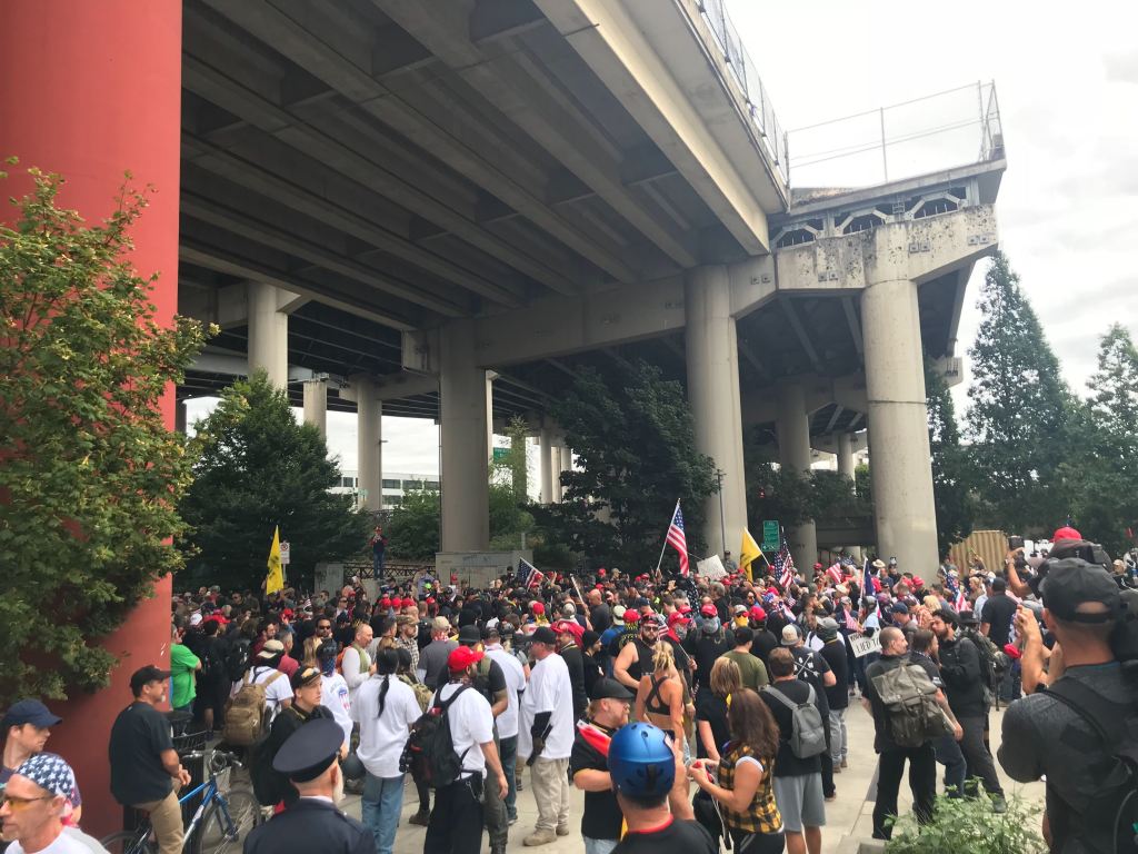 About 300 far-right protesters have gathered in Portland for a Saturday march to “End Domestic Terrorism” aimed at antifa. Hundreds of counterprotesters, many of whom are with antifa, have also showed up. Riot police are guarding rows of metal barricades