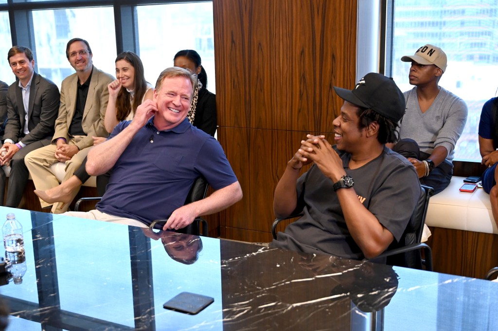 Roger Goodell and Jay-Z at a meeting.