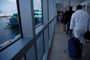 evacuees had originally been told they’d be able to enter the U.S. with just their Bahamian passports and a printout of their police record.