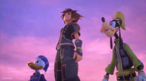 Screenshot from Kingdom Hearts 3, Sora, a young brown haired boy, Donald, a duck, and Goofy, a dog, stand together looking off frame, against a pink and purple sky