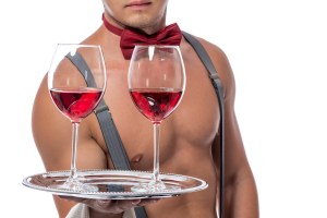 naked guy serving wine waiter