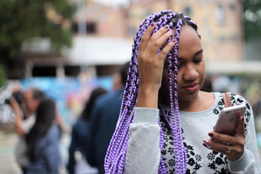 A woman looking at her phone.