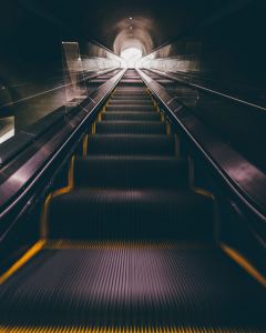 malaysia escalator woman falls through accident