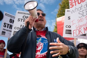 Illinois Federation of Teachers President Daniel Montgomery speaks as Chicago Public Schools teachers picket Thursday morning, Oct. 17, 2019, at Lane Tech High School in Chicago. (Colin Boyle/Chicago Sun-Times via AP)​