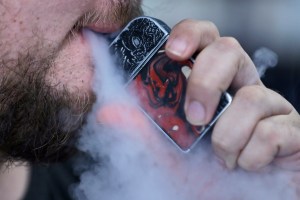 Cover image: FILE - In this Friday, Oct. 4, 2019 photo, a man using an electronic cigarette exhales in Mayfield Heights, Ohio. (AP Photo/Tony Dejak)​