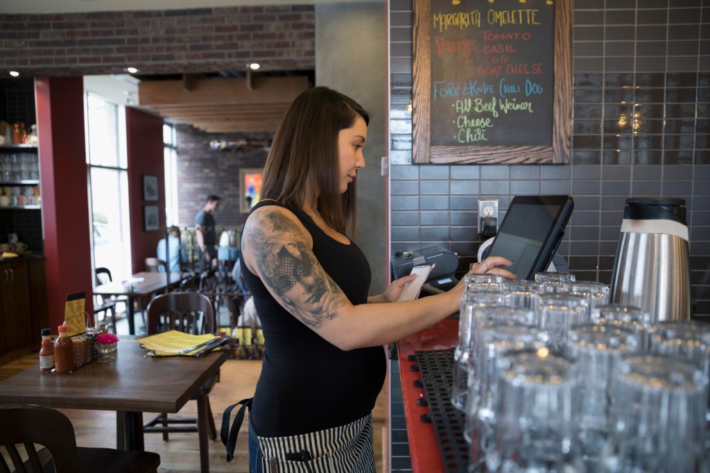 a pregnant woman at work