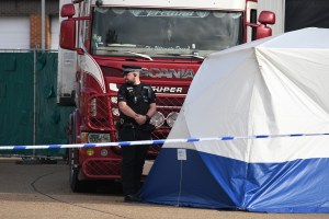 Police stand near the site where 39 bodies were discovered in the back of a lorry on October 23, 2019 in Thurrock, England.