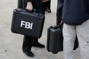 FBI agents carry waterproof cases containing newly 3d printed decoy heads, used to mount a famous prison escape in 1962, to a news conference on Alcatraz Island Thursday, Nov. 15, 2018, in San Francisco.