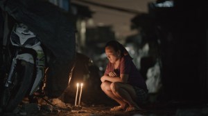 A woman mourns her brother lost in the drug war in the Philippines. Screenshot courtesy of Rat Park​