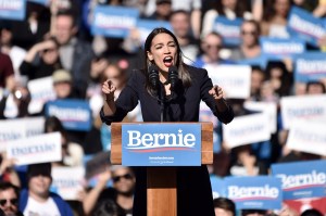 Alexandria Ocasio-Cortez endorses 2020 democratic presidential candidate Bernie Sanders at a Bernie Sanders campaign rally in Queensbridge Park on October 19, 2019 in Queens, New York City.