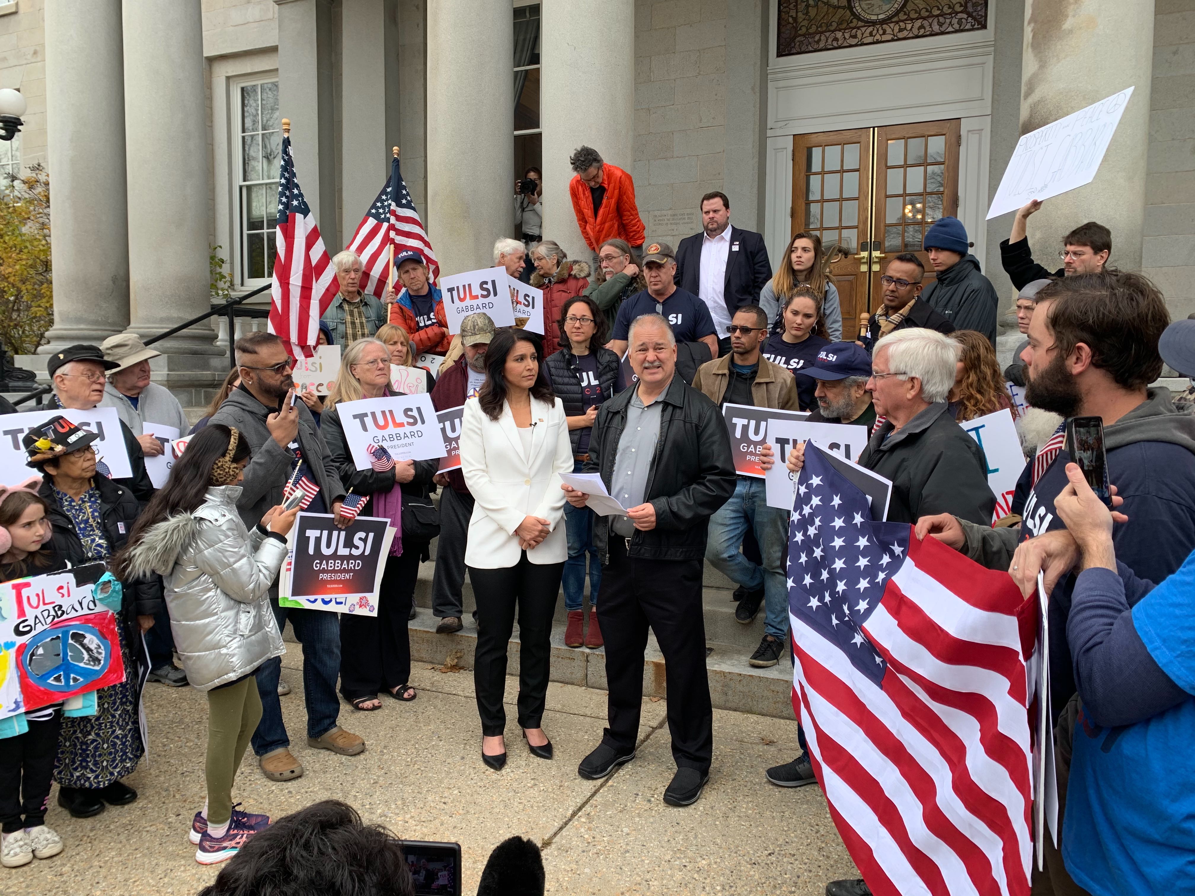 Gabbard and 9/11 survivor Tim Frolich address supporters at the New Hampshire statehouse.