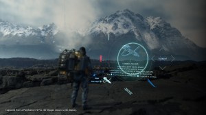 Screenshot from Death Stranding. Sam Bridges (played by Norman Reedus) stands at the edge of a ravine, wearing a large backpack filled with packages. An in game menu displaying a climbing rope floats to his right. In the distance there is a snow capped mo